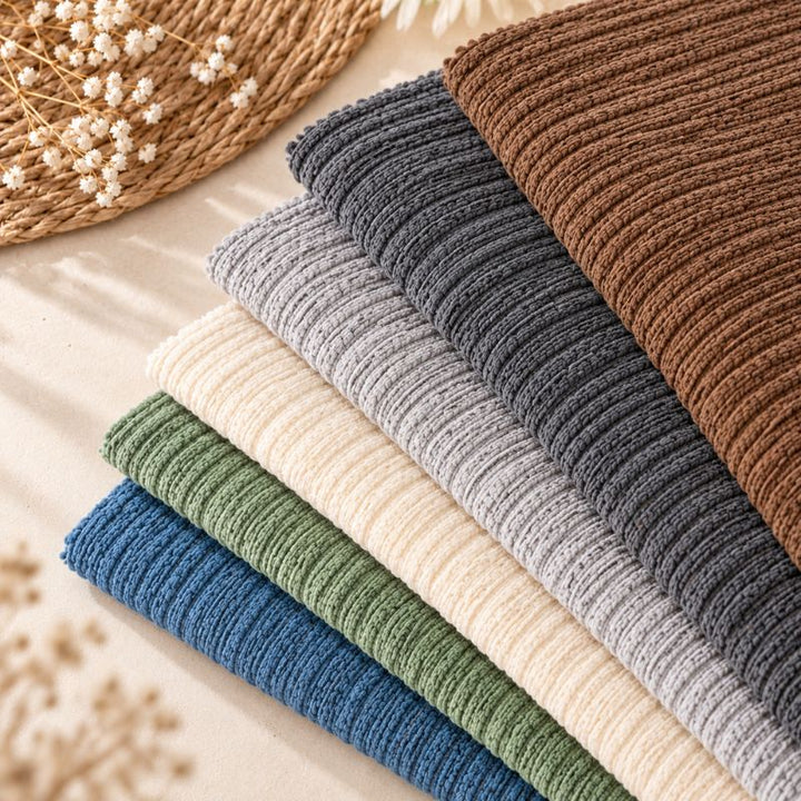 Housses de canapé en chenille CanapéCocon™ pliées dans les 6 coloris